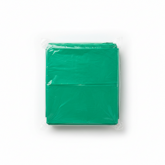 Pack of green paper sheets in clear plastic packaging on a white background